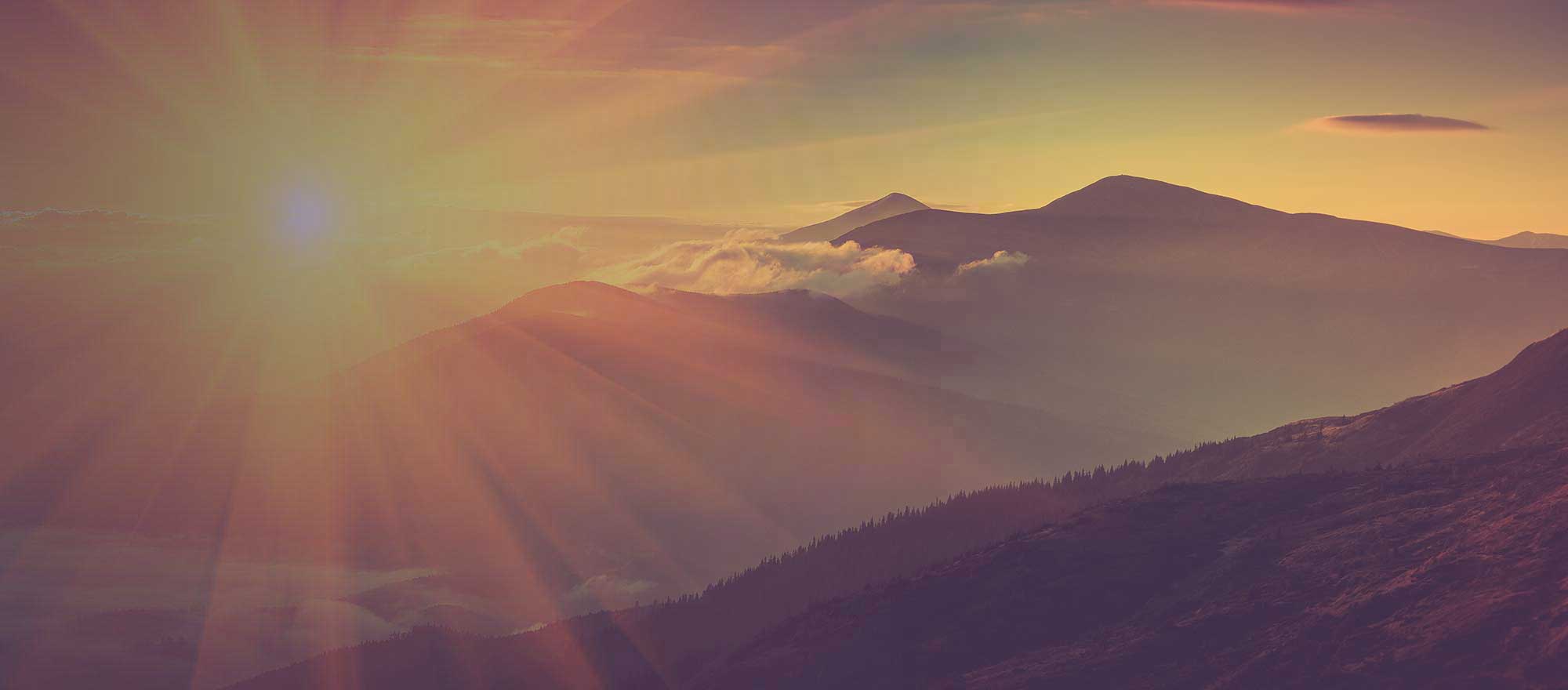 sunsetting over a mountain